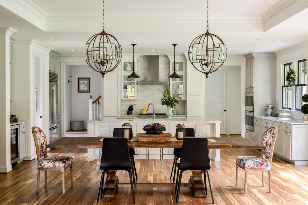 Example of a huge transitional medium tone wood floor kitchen/dining room combo design in Richmond with white walls