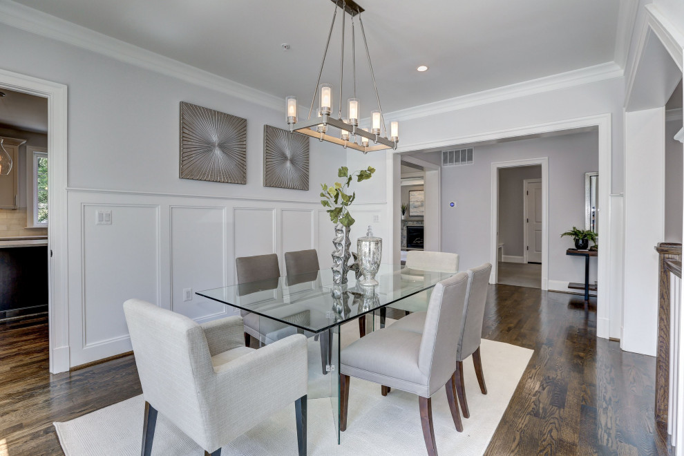 Inspiration for a large transitional separate dining room in DC Metro with grey walls, medium hardwood floors and brown floor.