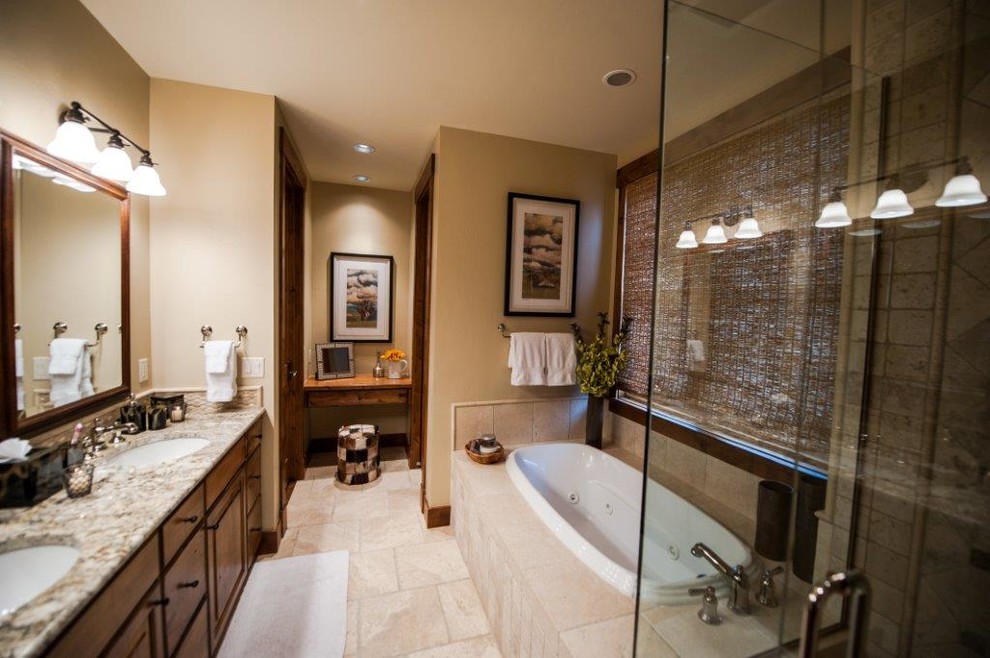 Inspiration for a mid-sized transitional master bathroom in Other with raised-panel cabinets, medium wood cabinets, an undermount tub, a corner shower, beige tile, porcelain tile, beige walls, an undermount sink and granite benchtops.