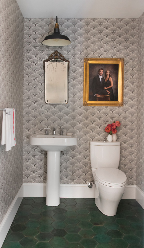 Photo of a transitional powder room in Boston with a two-piece toilet, grey walls, a pedestal sink and green floor.