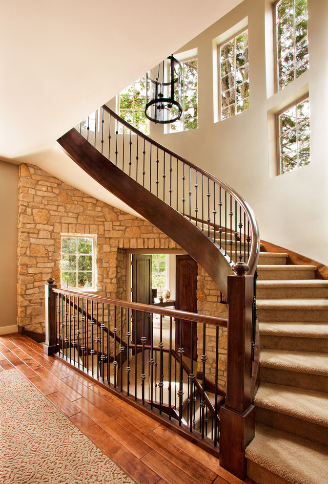Inspiration for a large transitional staircase in Portland.