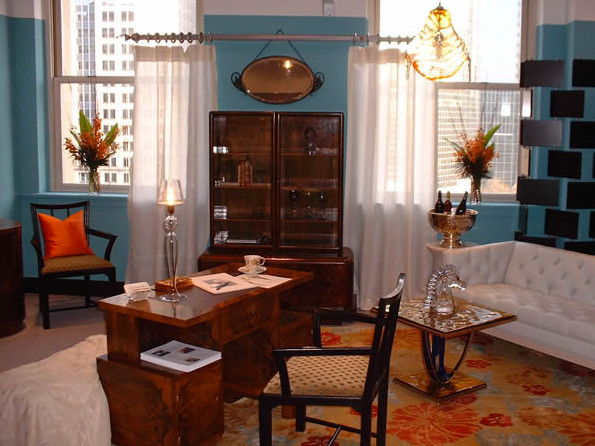 This is an example of a mid-sized contemporary study room in Other with blue walls, carpet and a freestanding desk.