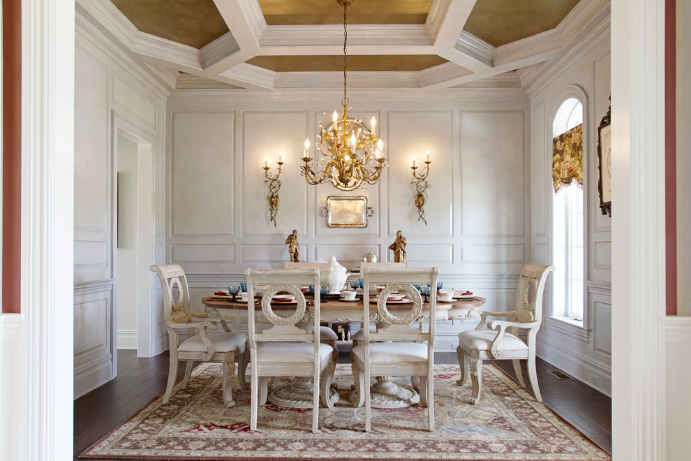 Photo of a traditional separate dining room in Orange County with white walls and dark hardwood floors.