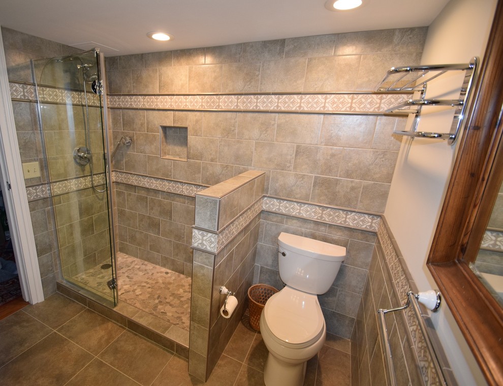 Example of a small transitional master multicolored tile and ceramic tile ceramic tile doorless shower design with raised-panel cabinets, white cabinets, a two-piece toilet, gray walls, a vessel sink and quartz countertops