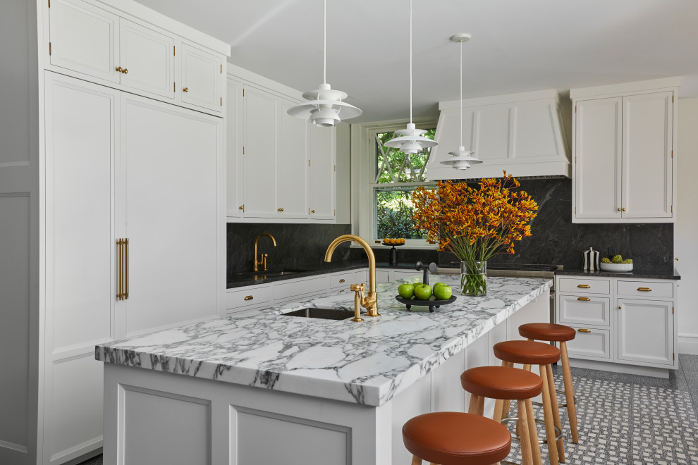 Large modern l-shaped eat-in kitchen in New York with an undermount sink, recessed-panel cabinets, white cabinets, marble benchtops, grey splashback, granite splashback, panelled appliances, ceramic floors, with island, grey floor and white benchtop.