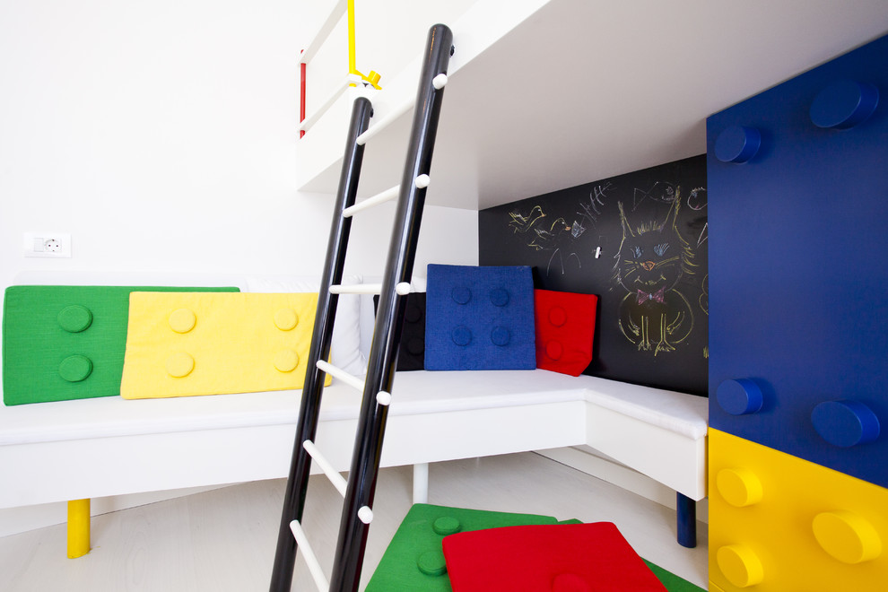 Design ideas for a modern gender-neutral kids' playroom in Other with white walls.