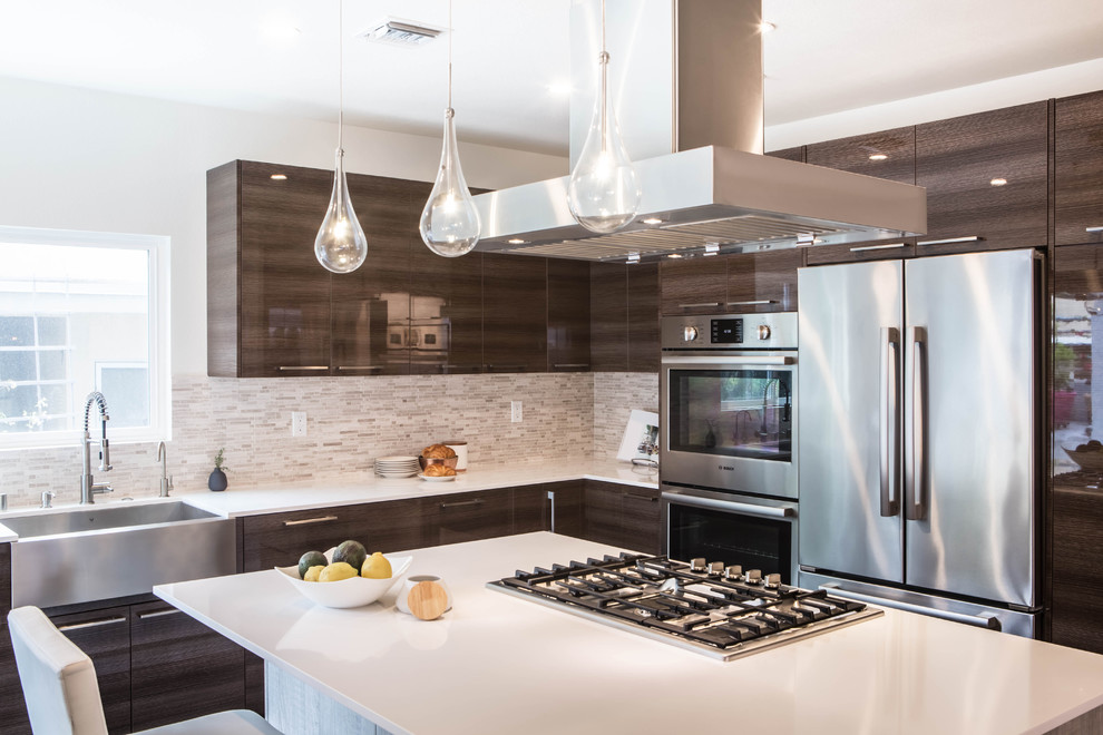 Mid-sized contemporary l-shaped eat-in kitchen in Los Angeles with an undermount sink, flat-panel cabinets, quartz benchtops, multi-coloured splashback, stainless steel appliances, porcelain floors, with island, dark wood cabinets and matchstick tile splashback.