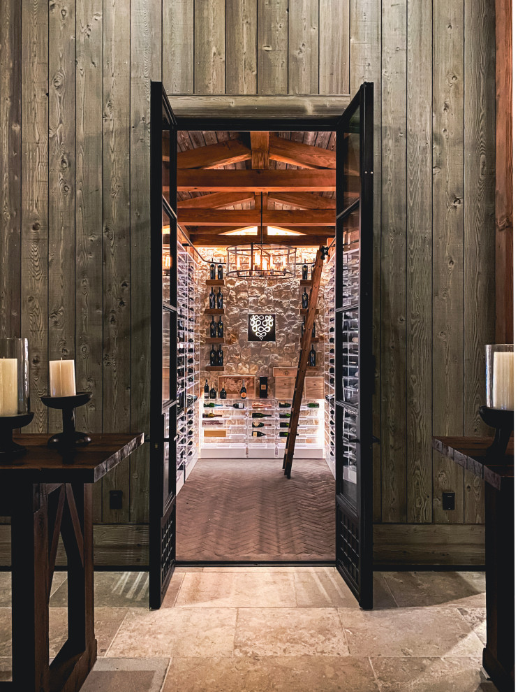 Photo of a large industrial wine cellar in San Francisco with brick floors, storage racks and grey floor.