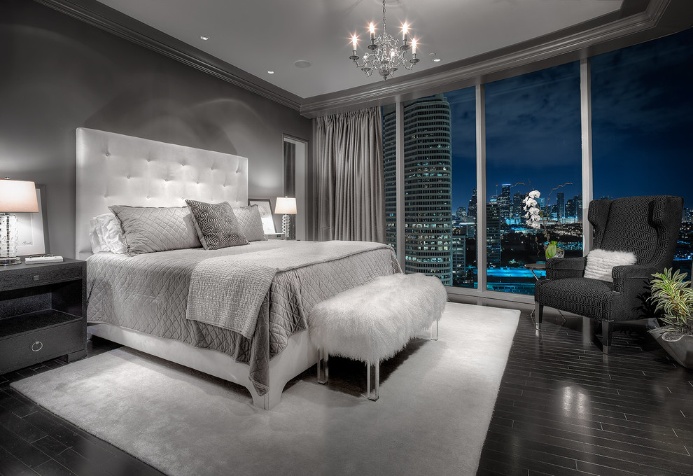 Design ideas for a contemporary bedroom in Houston with grey walls and black floor.