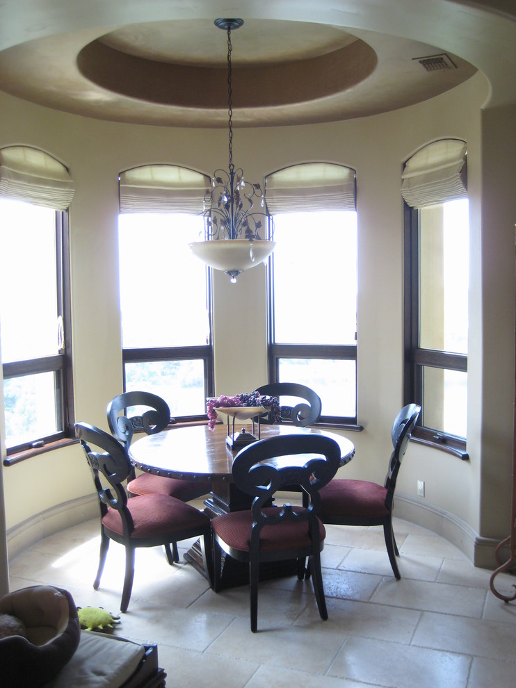 Inspiration for a mid-sized mediterranean separate dining room in Sacramento with beige walls and ceramic floors.