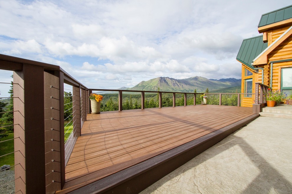 Mid-sized mountain style backyard deck photo with no cover