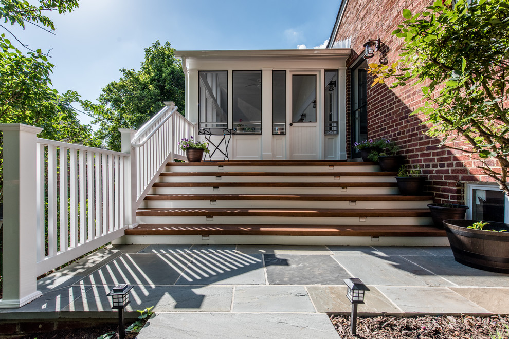 Design ideas for a mid-sized contemporary backyard screened-in verandah in DC Metro with concrete pavers and a roof extension.