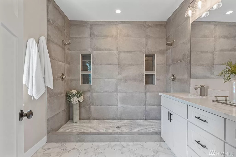 Photo of a large contemporary master bathroom in Seattle with shaker cabinets, white cabinets, a double shower, a one-piece toilet, gray tile, grey walls, porcelain floors, an undermount sink, engineered quartz benchtops, white floor, a hinged shower door, white benchtops, a niche, a double vanity and a built-in vanity.