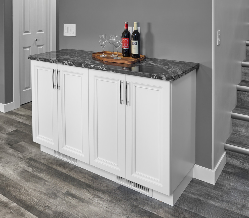 Inspiration for a mid-sized transitional galley vinyl floor and gray floor eat-in kitchen remodel in Edmonton with an undermount sink, recessed-panel cabinets, white cabinets, granite countertops, white backsplash, subway tile backsplash, stainless steel appliances and an island