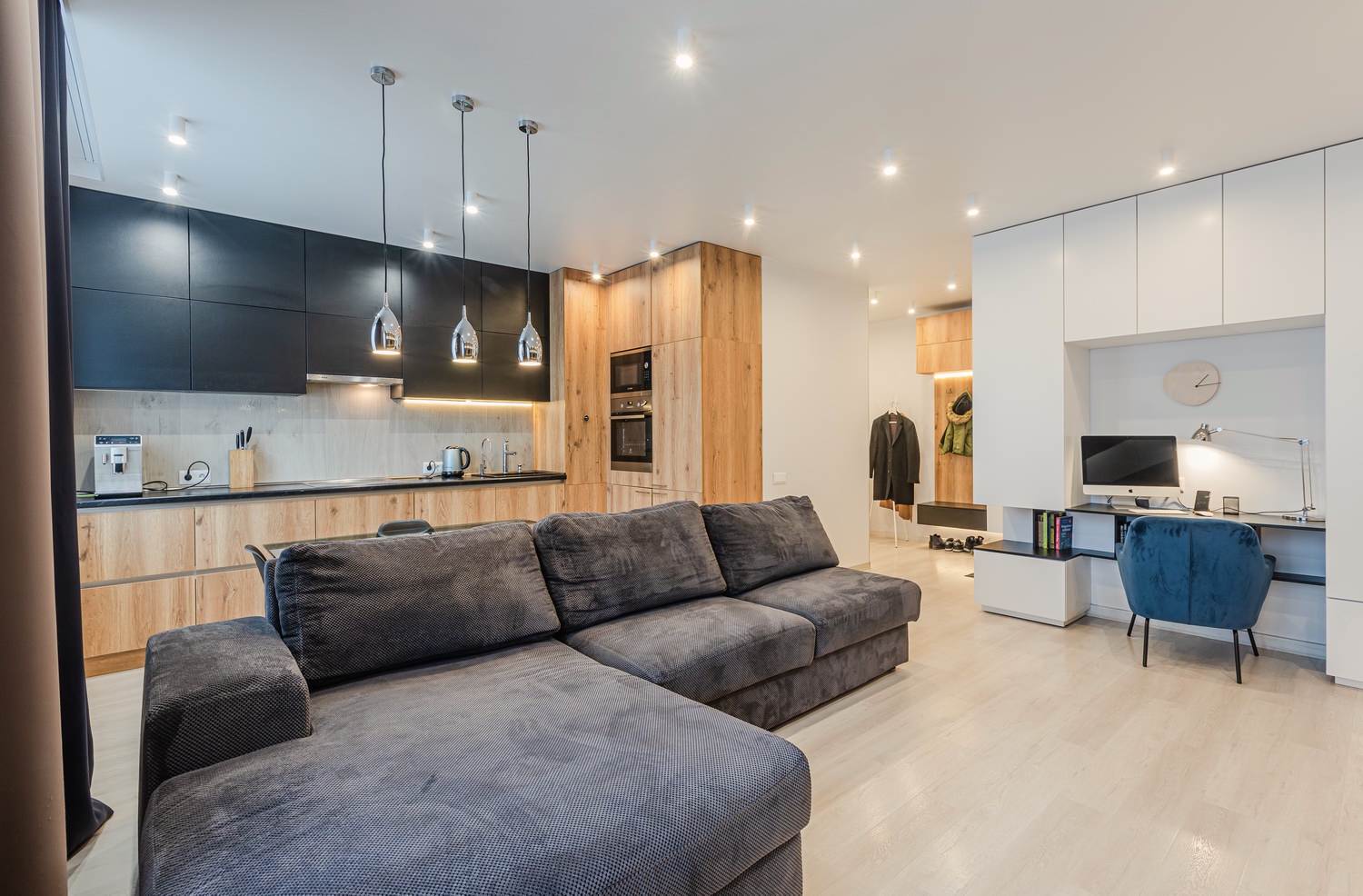 Kitchen living room with a large sofa in a modern style