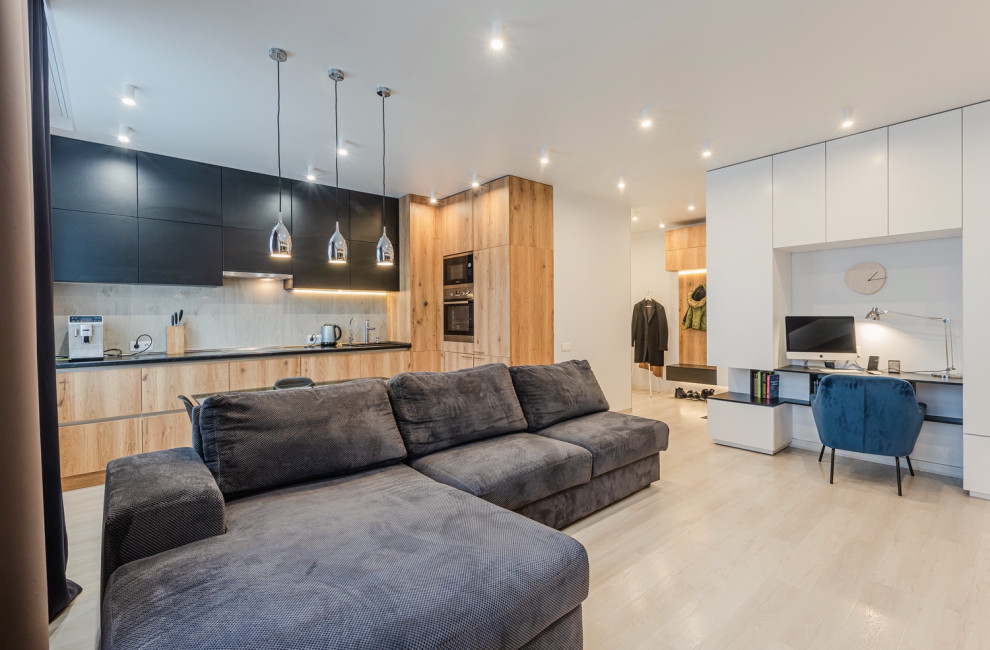 Kitchen living room with a large sofa in a modern style