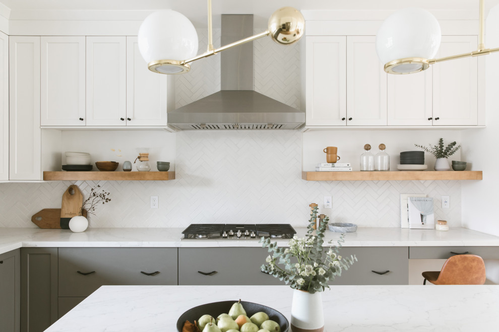 Inspiration for a large modern u-shaped open plan kitchen in San Francisco with an undermount sink, shaker cabinets, grey cabinets, quartz benchtops, white splashback, ceramic splashback, stainless steel appliances, medium hardwood floors, with island, brown floor and yellow benchtop.