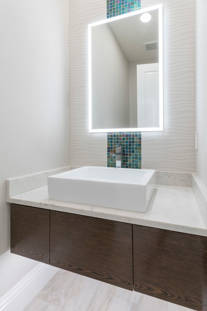 This is an example of a transitional powder room in Orlando.
