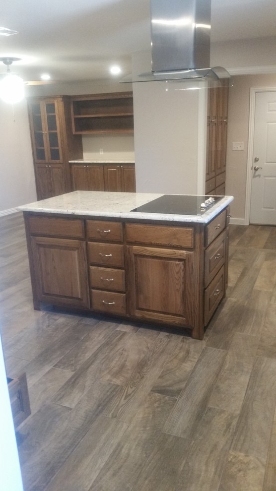 Large traditional single-wall separate kitchen in Dallas with an undermount sink, raised-panel cabinets, beige splashback, stainless steel appliances, ceramic floors, with island, light wood cabinets, quartz benchtops, porcelain splashback and beige floor.