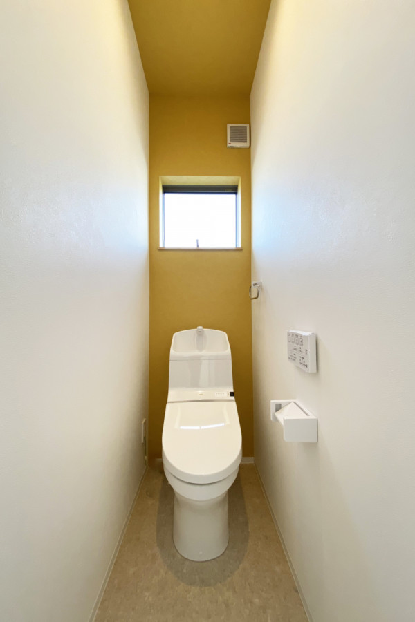 Photo of a powder room in Kyoto with yellow walls, wallpaper and wallpaper.