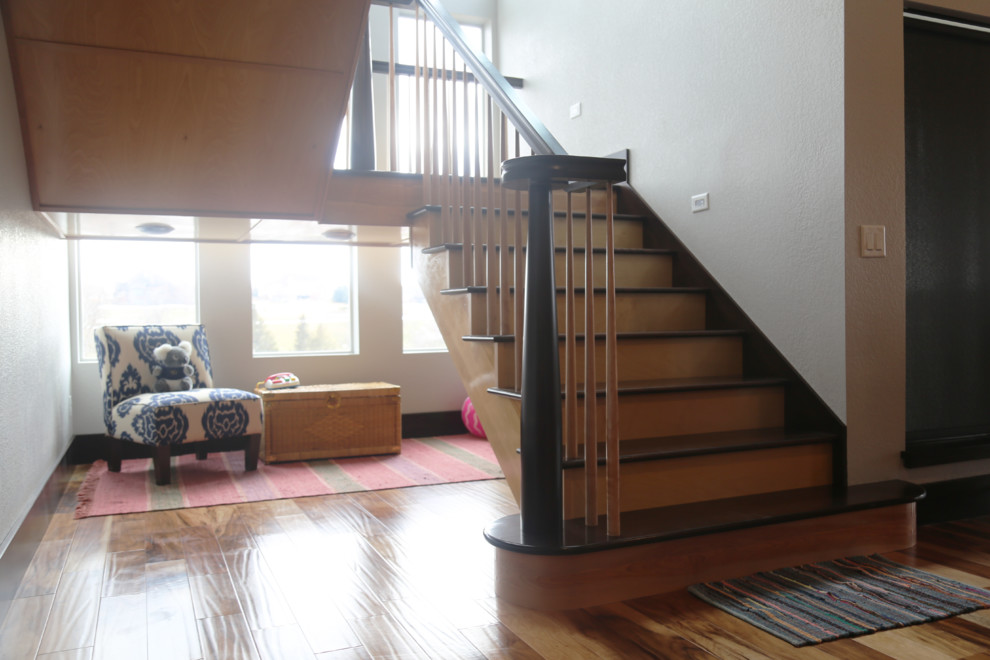 Home design - large transitional wooden u-shaped home design idea with wooden risers
