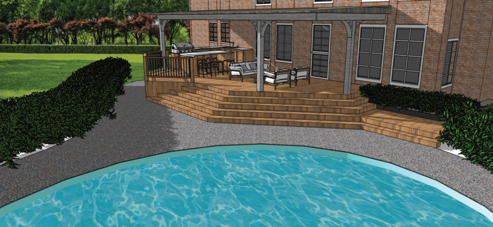 Photo of a large backyard and ground level deck with an outdoor kitchen, a pergola and mixed railing.