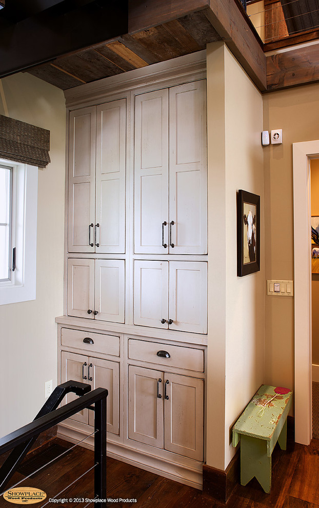 Eat-in kitchen - rustic eat-in kitchen idea with a farmhouse sink, beaded inset cabinets, green cabinets, limestone countertops, yellow backsplash and stainless steel appliances