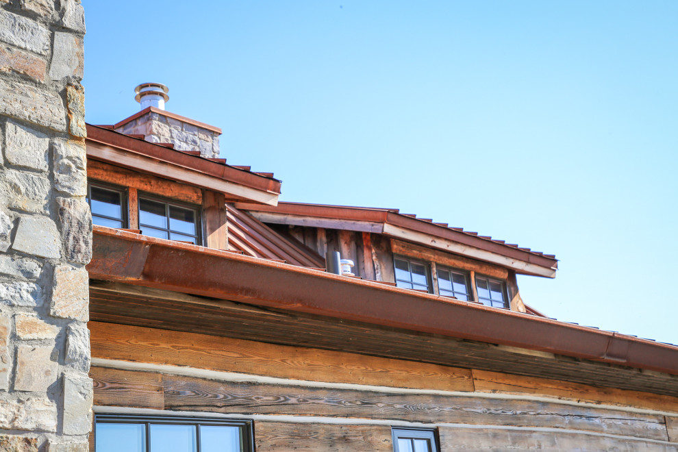 Example of a mountain style home design design in Calgary