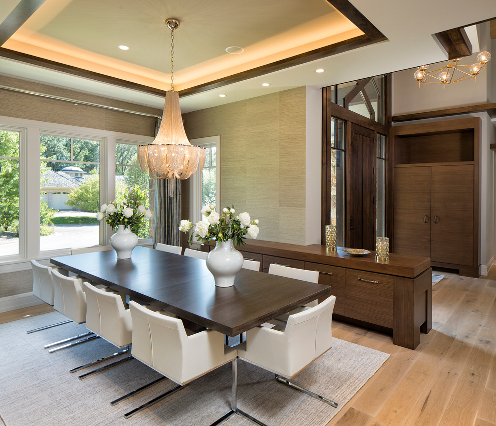 Contemporary dining room in Minneapolis with light hardwood floors and beige walls.