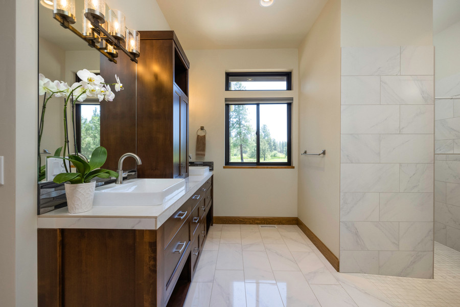 Design ideas for a traditional master bathroom in Other with an open shower, porcelain floors, tile benchtops, a double vanity and a freestanding vanity.