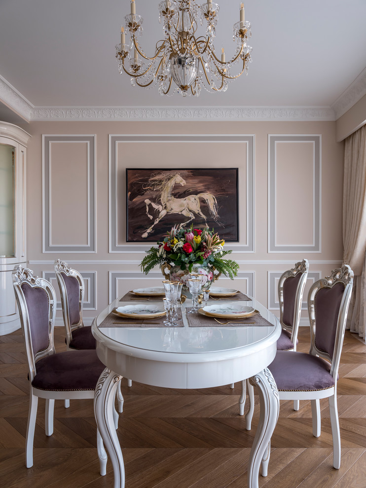Inspiration for a mid-sized traditional separate dining room in Moscow with beige walls, medium hardwood floors and brown floor.