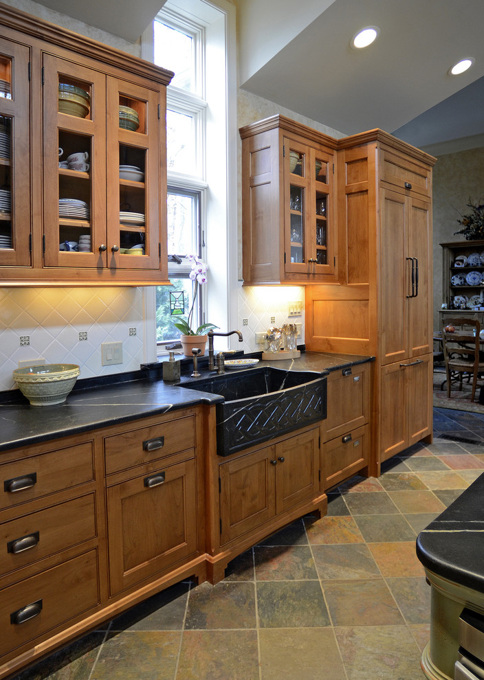 Photo of a traditional kitchen in Cincinnati with a farmhouse sink and slate floors.
