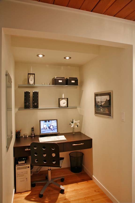 Photo of a small contemporary study room in Vancouver with beige walls, dark hardwood floors, no fireplace, a built-in desk and brown floor.