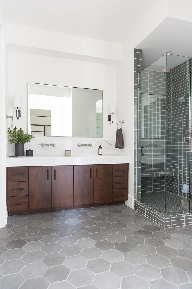 Design ideas for a large country bathroom in Salt Lake City with dark wood cabinets, an alcove shower, gray tile, white walls, a hinged shower door and white benchtops.