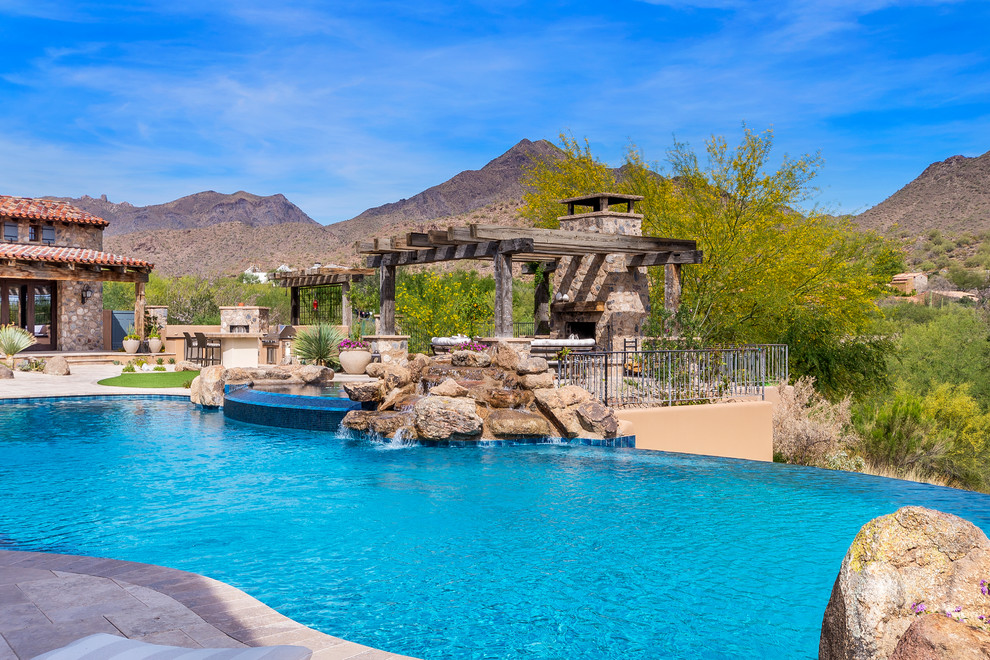 Inspiration for a rustic pool remodel in Phoenix