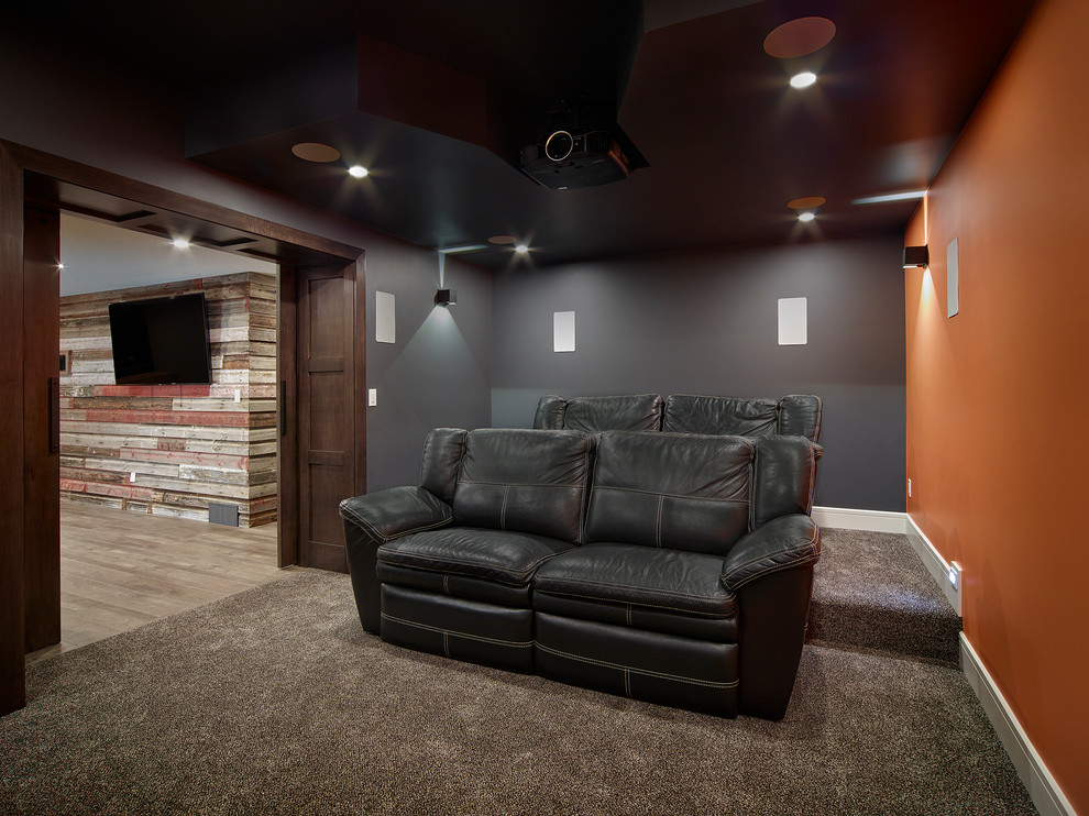Design ideas for a mid-sized country enclosed home theatre in Vancouver with multi-coloured walls, carpet and a projector screen.