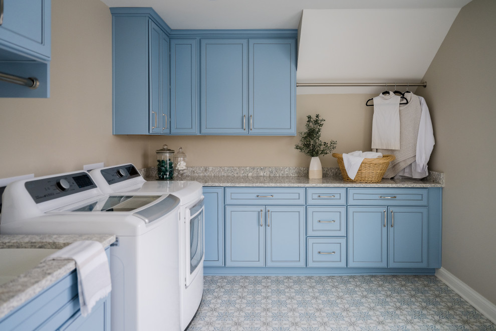 Mid-sized traditional galley dedicated laundry room in Indianapolis with an undermount sink, blue cabinets, granite benchtops, beige walls, ceramic floors and a side-by-side washer and dryer.