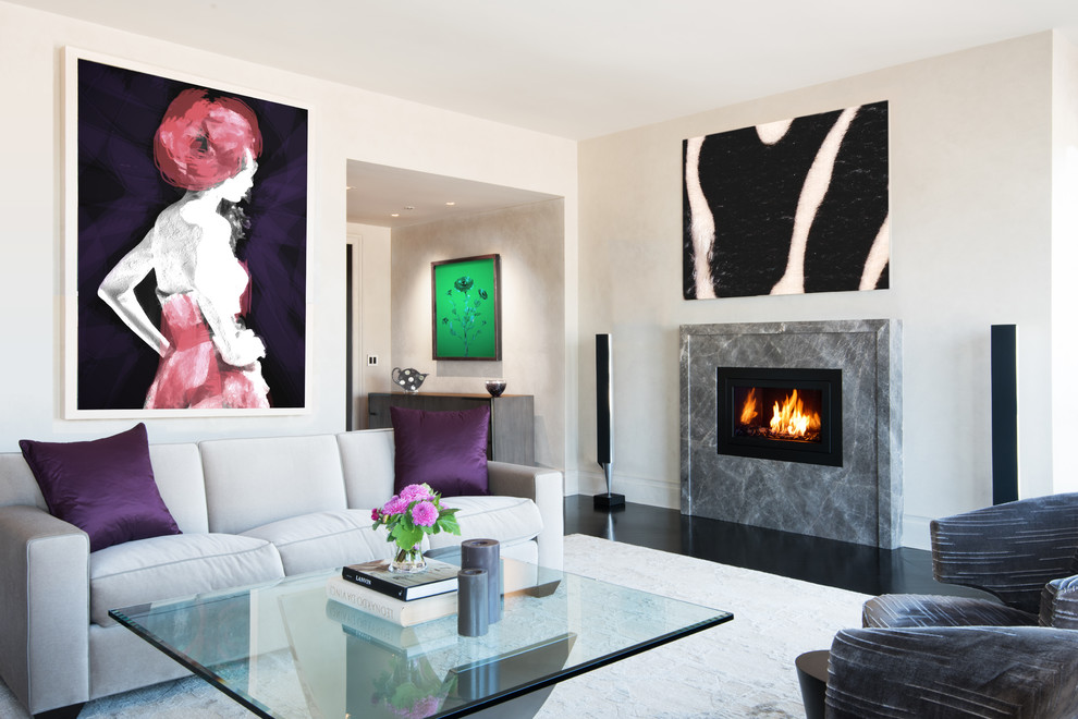 Contemporary living room in New York with beige walls, a standard fireplace and a stone fireplace surround.