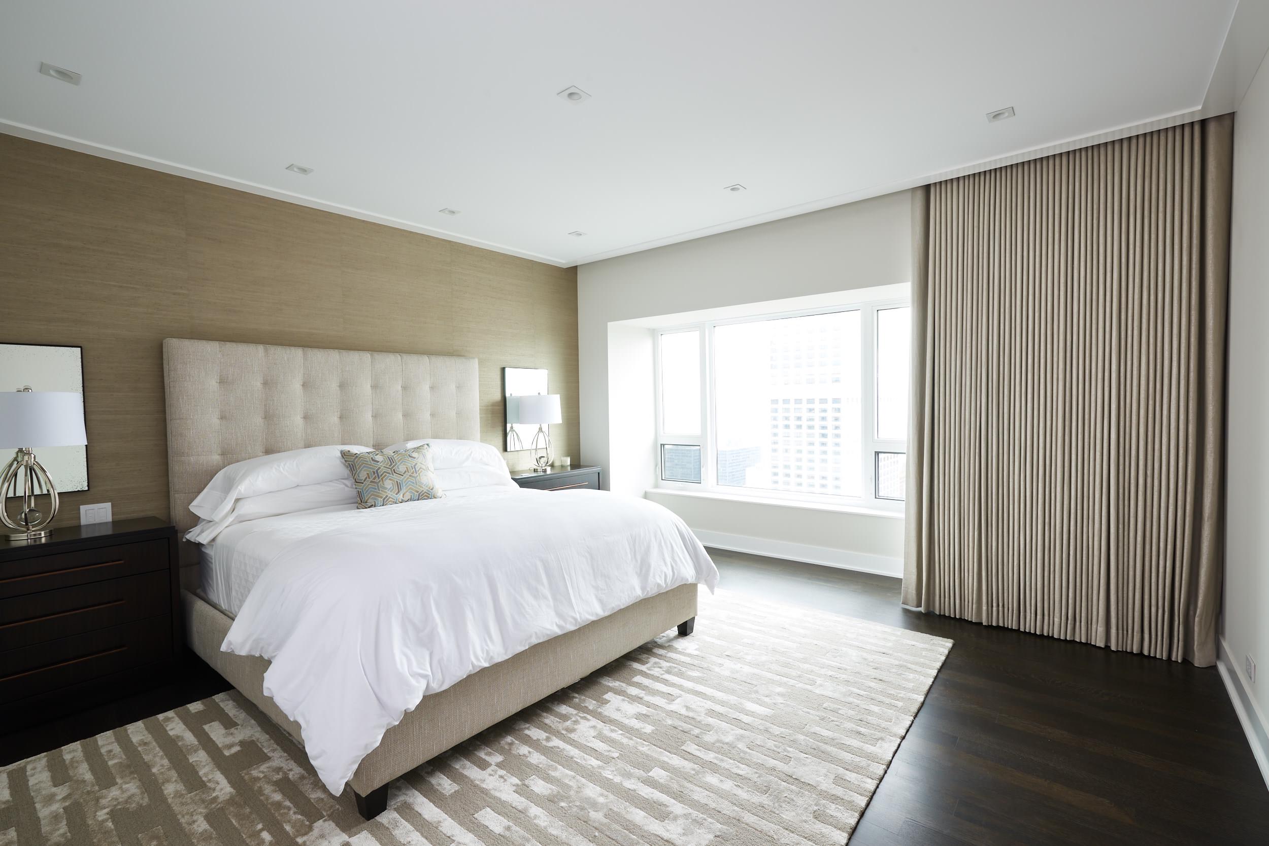 Inspiration for a large transitional master dark wood floor and brown floor bedroom remodel in Chicago with gray walls and no fireplace