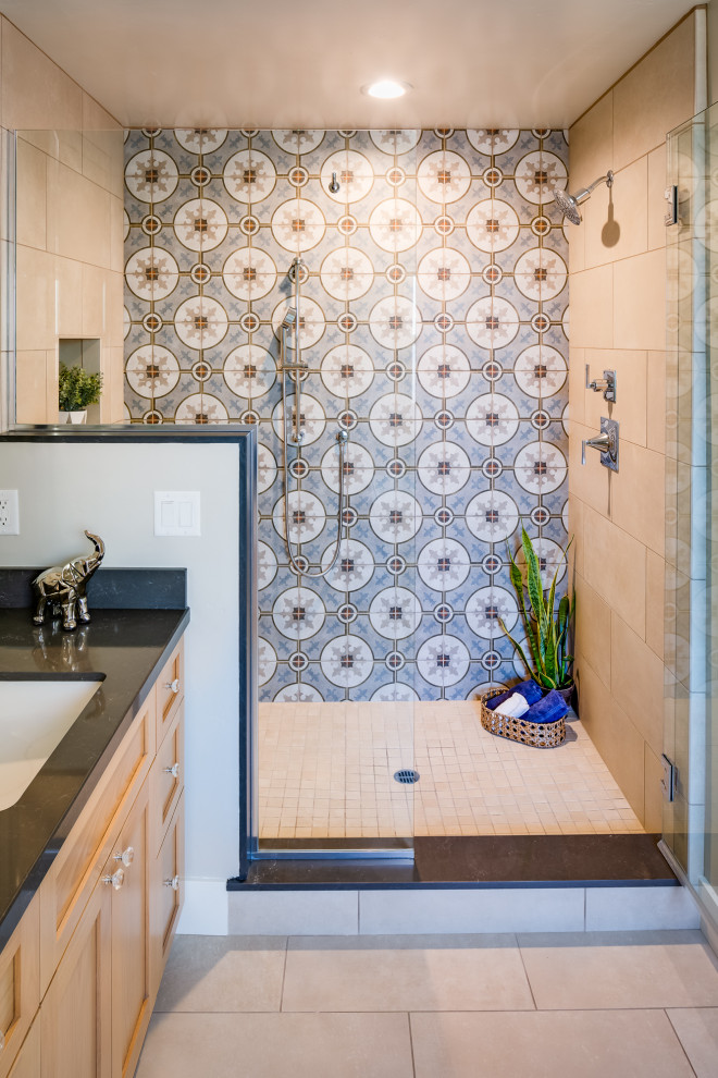 Inspiration for a mid-sized eclectic master bathroom in San Diego with recessed-panel cabinets, light wood cabinets, a double shower, multi-coloured tile, porcelain tile, beige walls, ceramic floors, an undermount sink, engineered quartz benchtops, beige floor, an open shower and black benchtops.