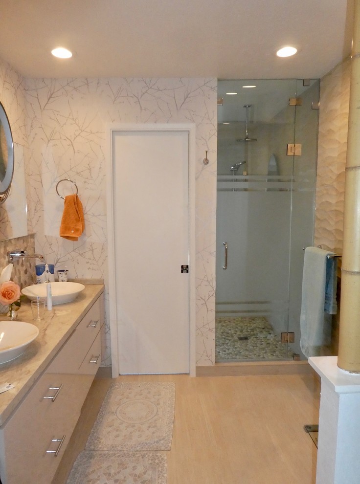 Inspiration for a mid-sized transitional master porcelain tile and beige floor alcove shower remodel with flat-panel cabinets, beige cabinets, beige walls, a vessel sink, quartzite countertops, a hinged shower door and beige countertops