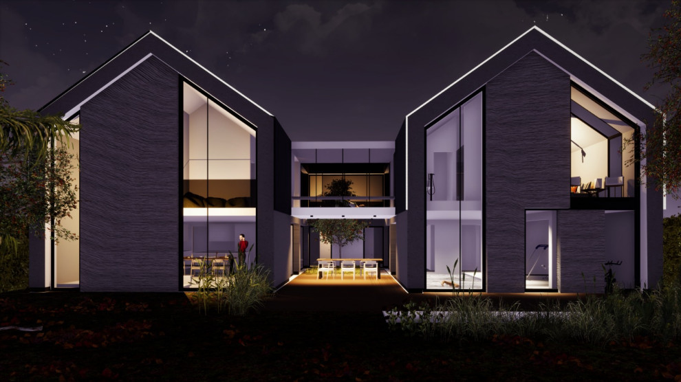Inspiration pour une très grande façade de maison grise design en béton à un étage avec un toit à deux pans, un toit en métal et un toit noir.
