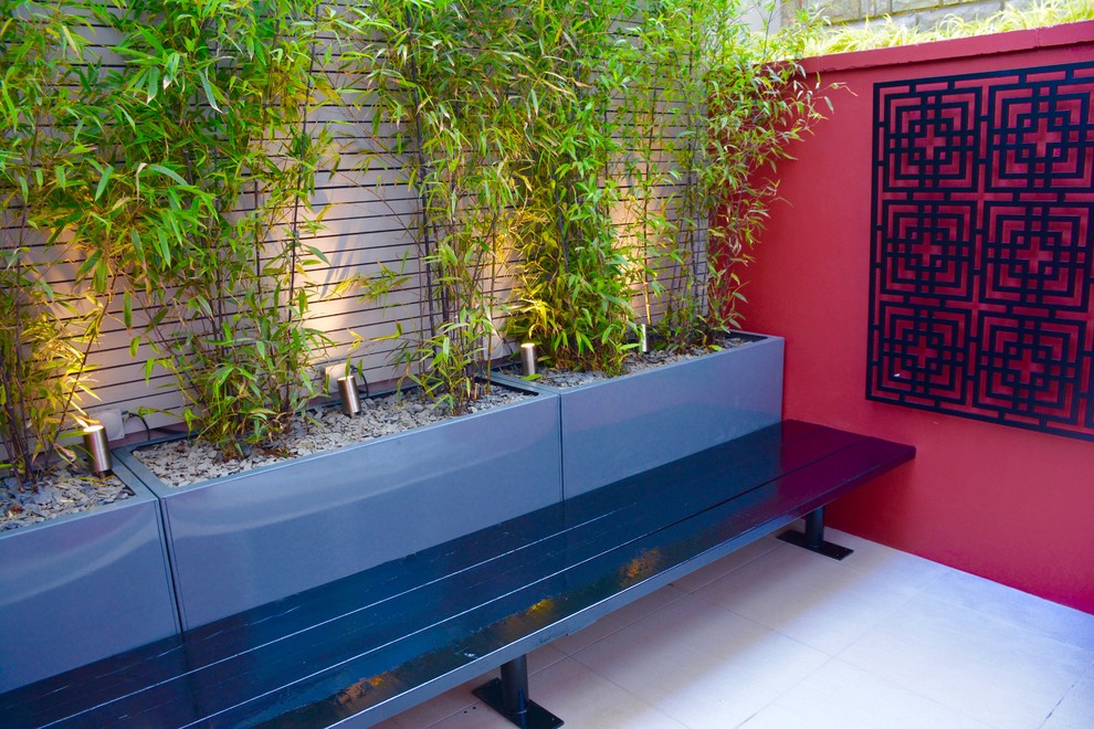 Design ideas for a small asian courtyard partial sun garden in London.