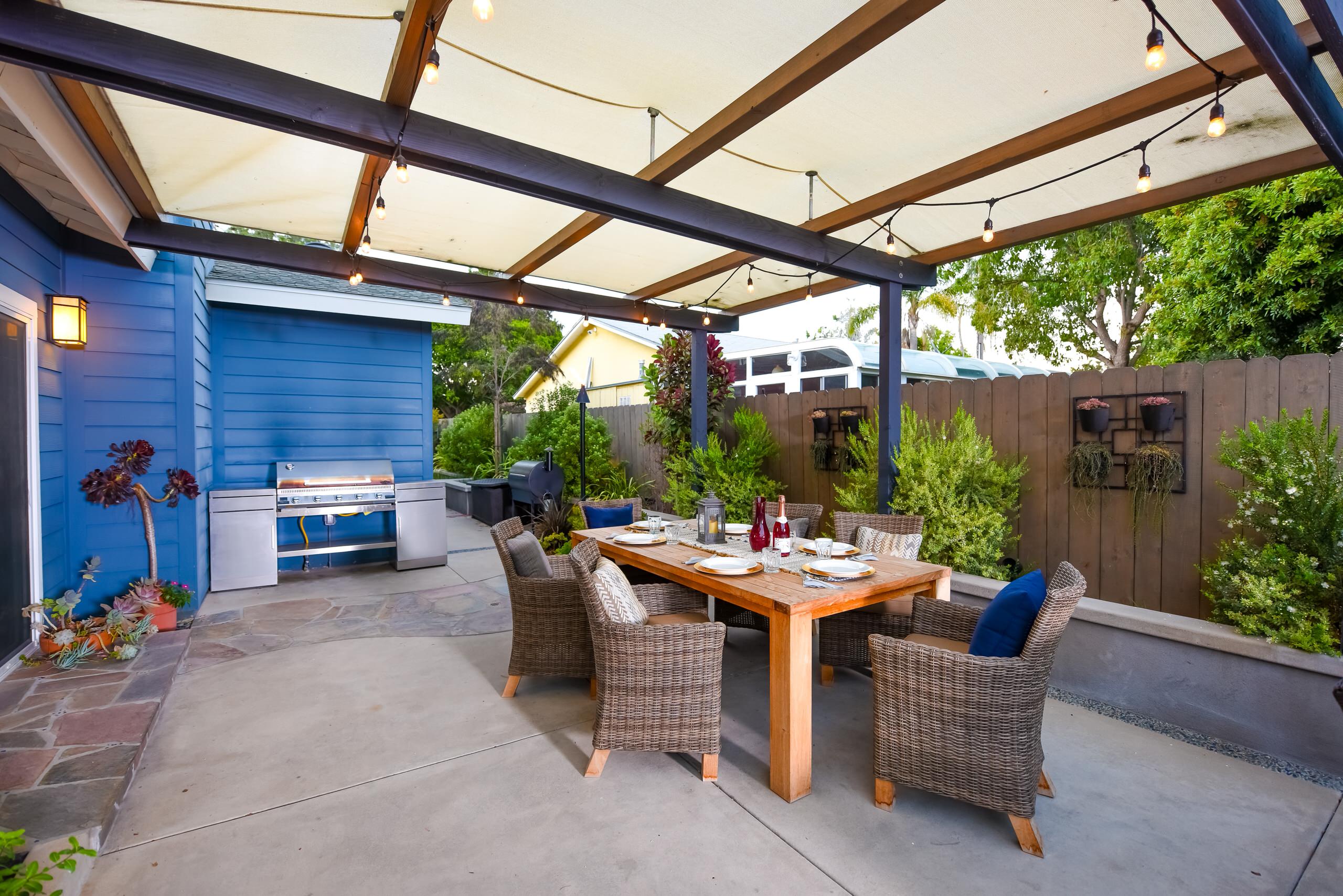 Outdoor Dining Area with Cover and Cafe Lights