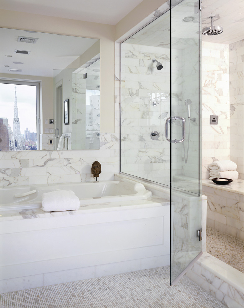 Inspiration for a contemporary bathroom in New York with mosaic tile floors, marble and a shower seat.