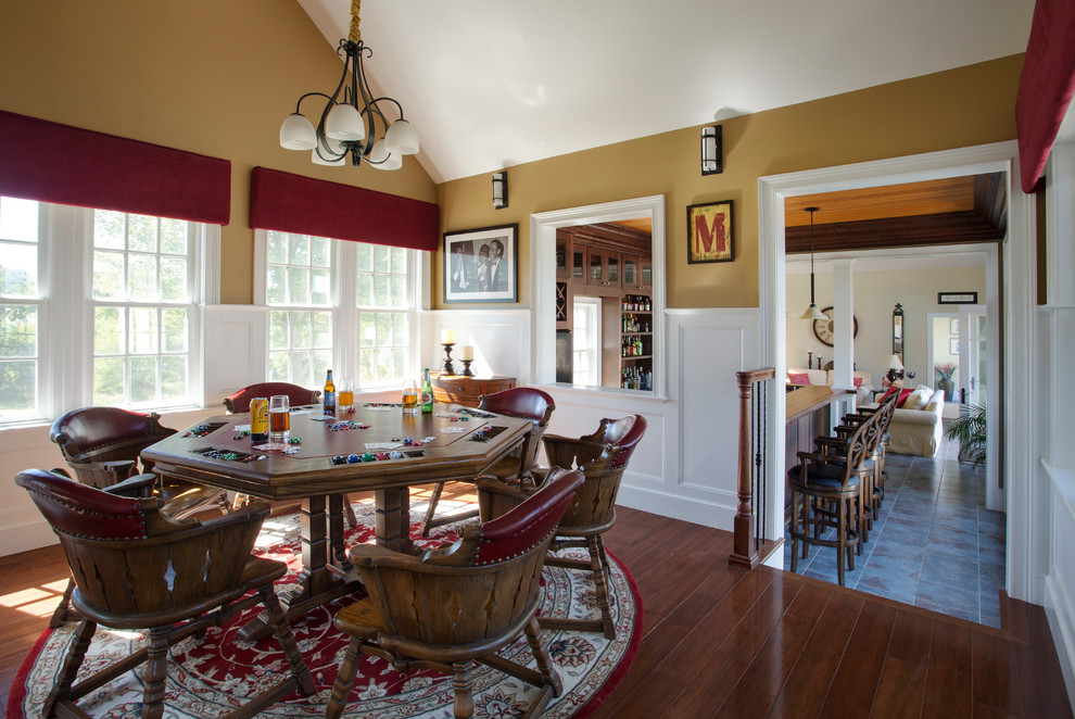 This is an example of a mid-sized traditional dining room in Boston with yellow walls, dark hardwood floors and no fireplace.