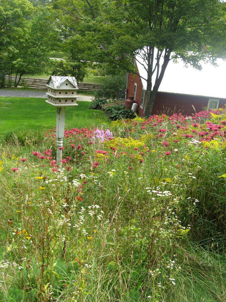 This is an example of a small rustic backyard landscaping in Burlington.