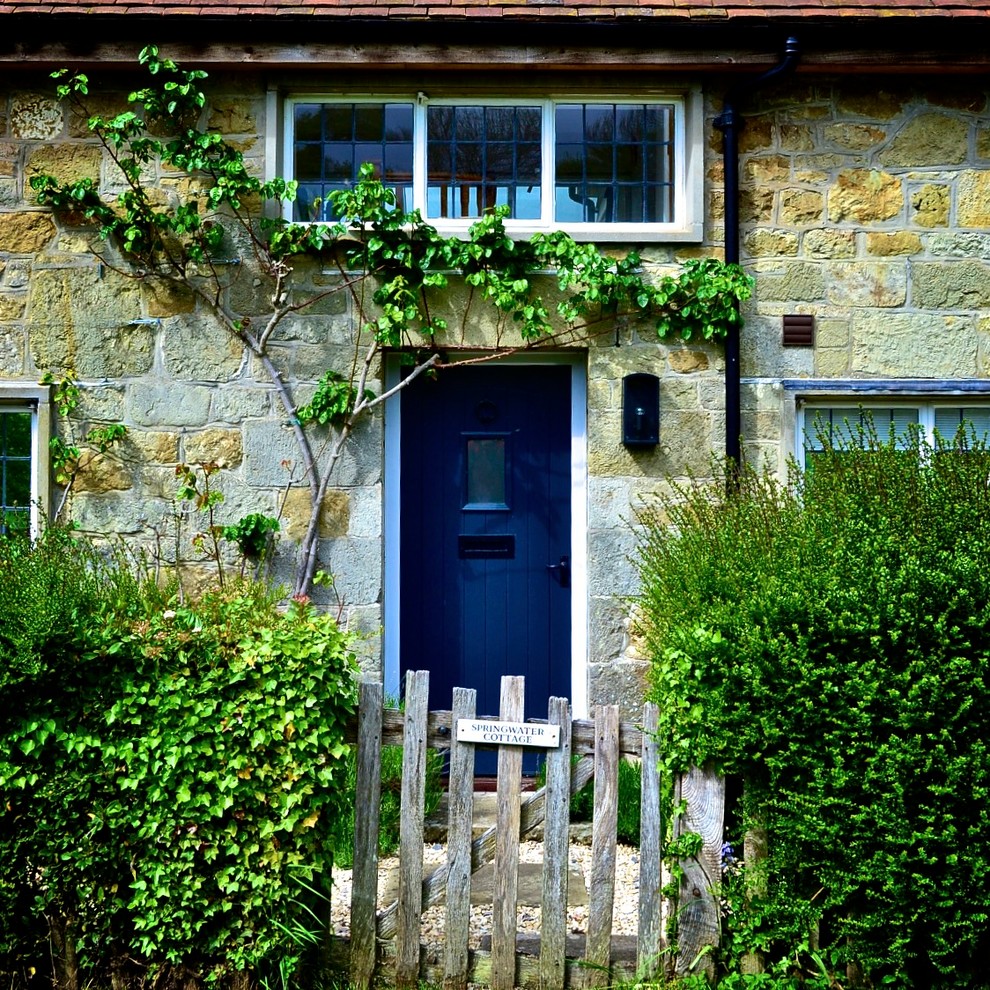 Design ideas for a rustic front door in Dorset with a single front door and a blue front door.