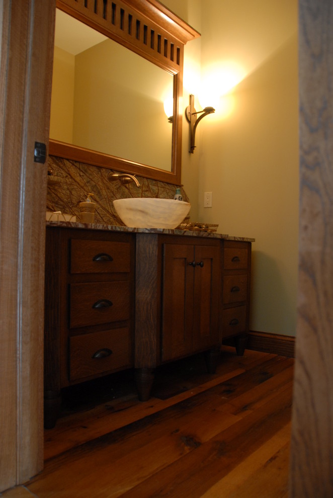 Small arts and crafts 3/4 bathroom in Chicago with a vessel sink, flat-panel cabinets, medium wood cabinets, granite benchtops, yellow walls, medium hardwood floors, brown floor and grey benchtops.