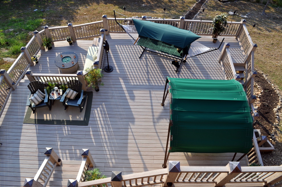 Inspiration for a mid-sized transitional rooftop deck remodel with a roof extension